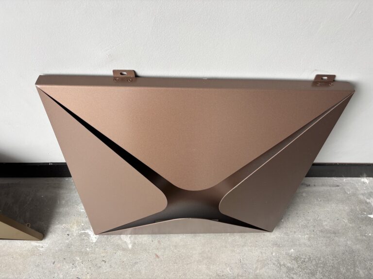 Folded stainless steel honeycomb panels in rose gold, mirror, and brushed bronze finishes, shown in factory and mounting-bracket detail views.