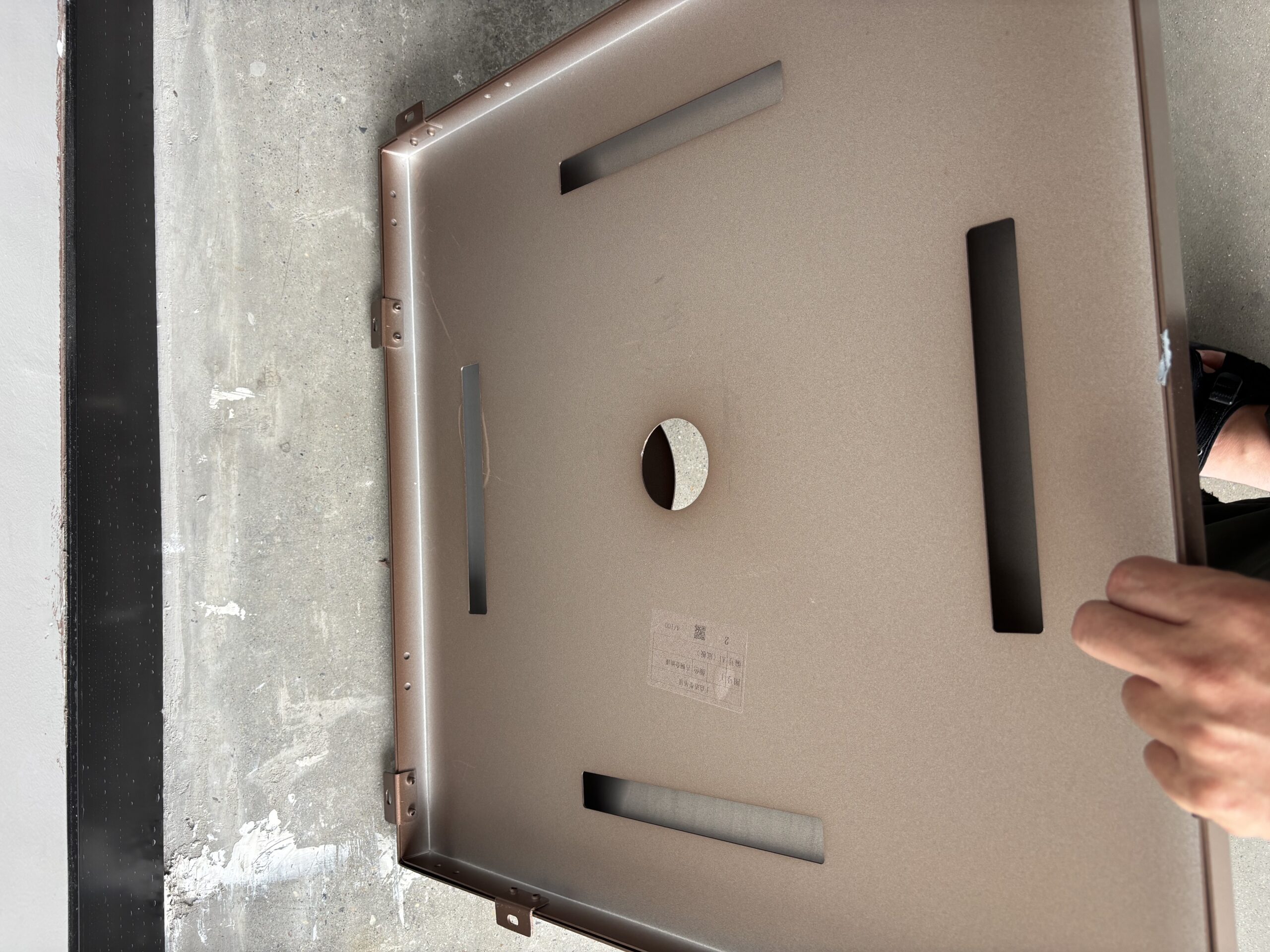 Back view of stainless steel honeycomb panel showing aluminum honeycomb core and pre-welded mounting brackets.