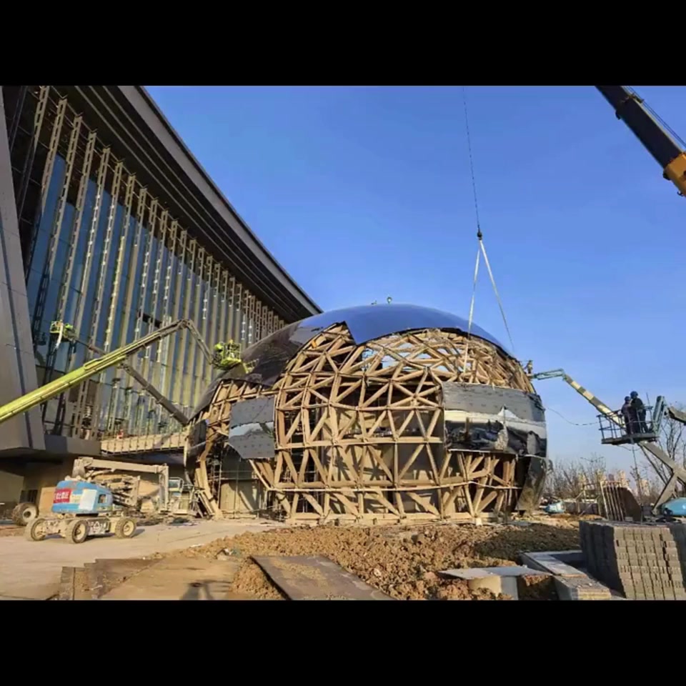 Reflective shell being installed on the egg