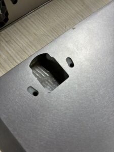 Close-up of the rear-mount slots and concealed hanging system on an ARTDSN stainless steel honeycomb cabinet door panel