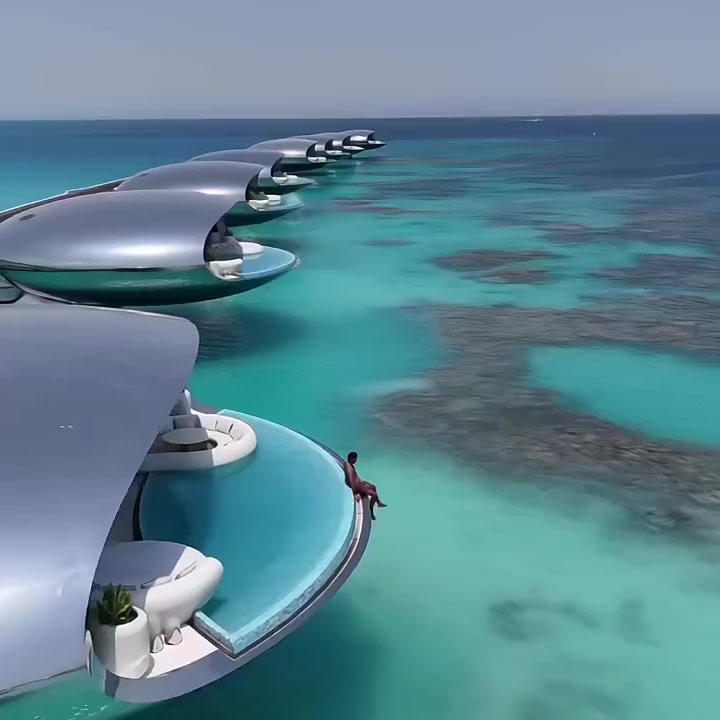 Pod villa terrace with private plunge pool and curved walkway