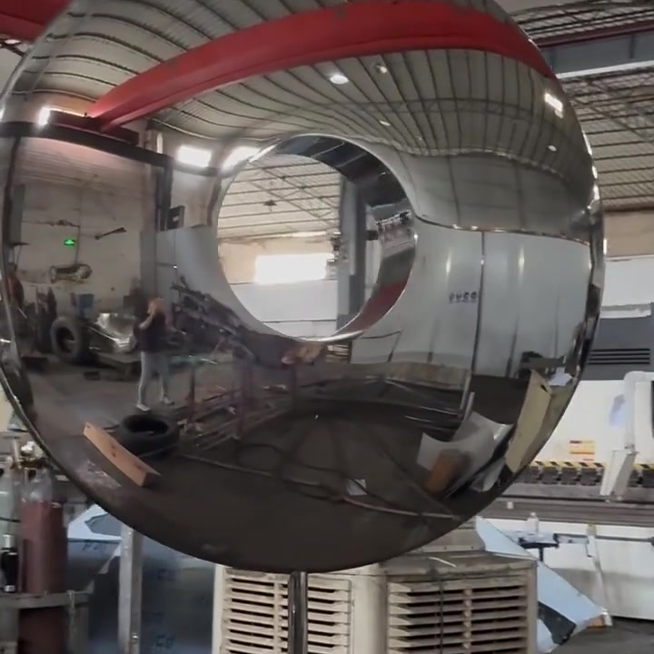 Final front view of the completed stainless steel ring sculpture with a clean mirror finish