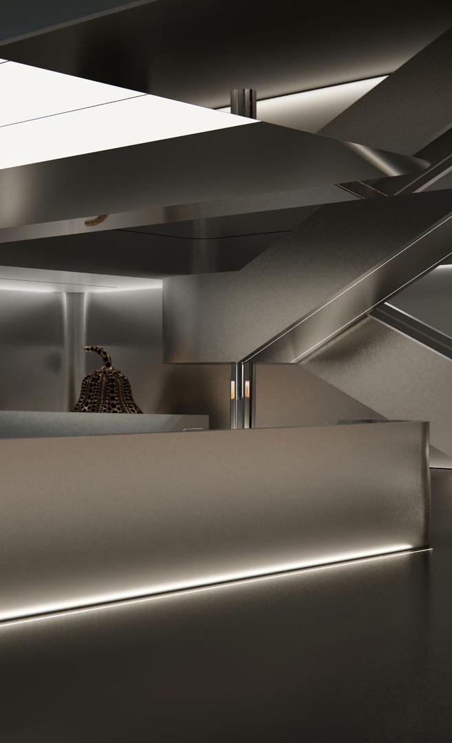 Faceted stainless steel ceiling with glowing light panels and mirror polished column above a reception desk in a high-end showroom